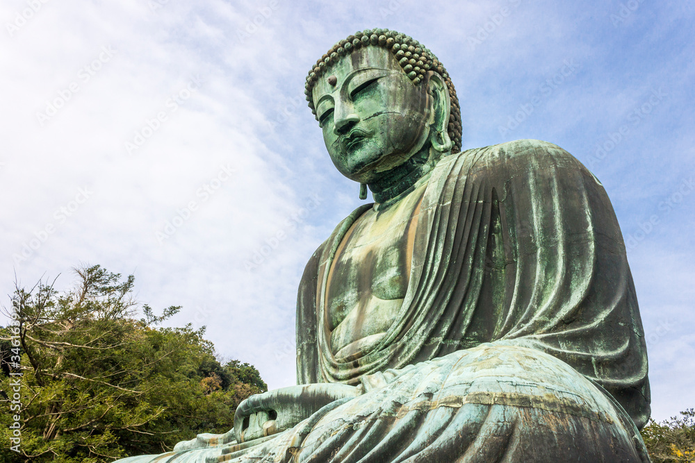 Kamakura, Japan. Views of the Great Buddha (Daibutsu), large bronze statue representing Amida Buddha (Amitabha) in Kotoku-in Buddhist temple Kamakura, Japan. Views of the Great Buddha (Daibutsu), large bronze statue representing Amida Buddha (Amitabha) in Kotoku-in Buddhist temple