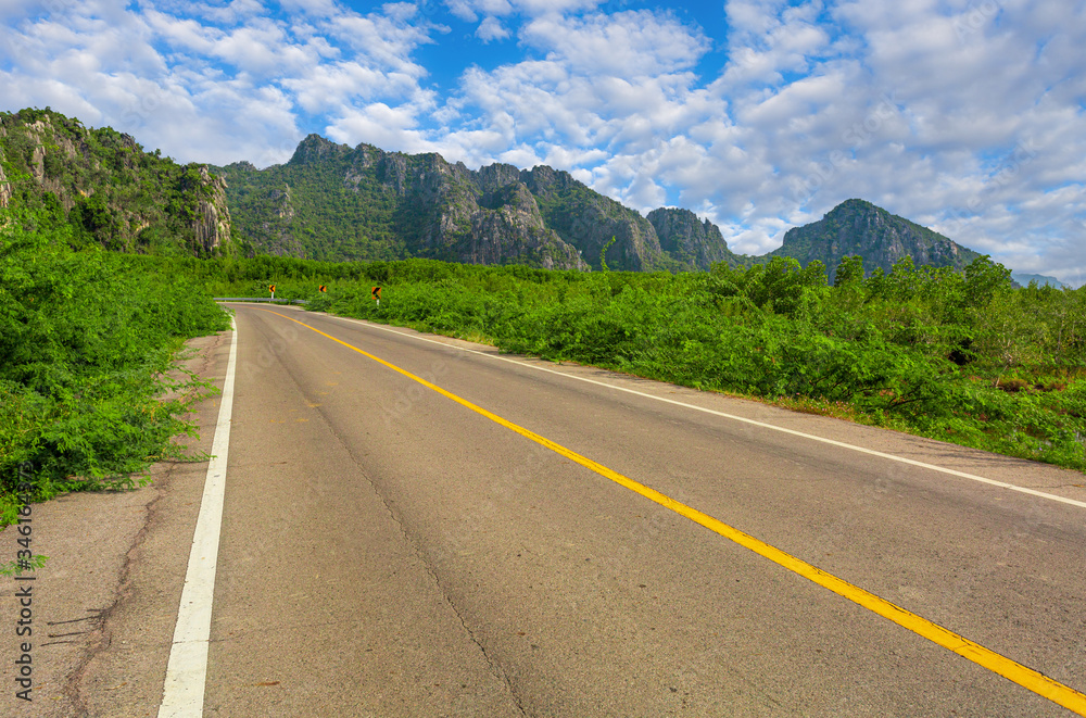 Green mountain and empty asphalt highway natural scenery ,Asphalt highways and mountains under the blue sky