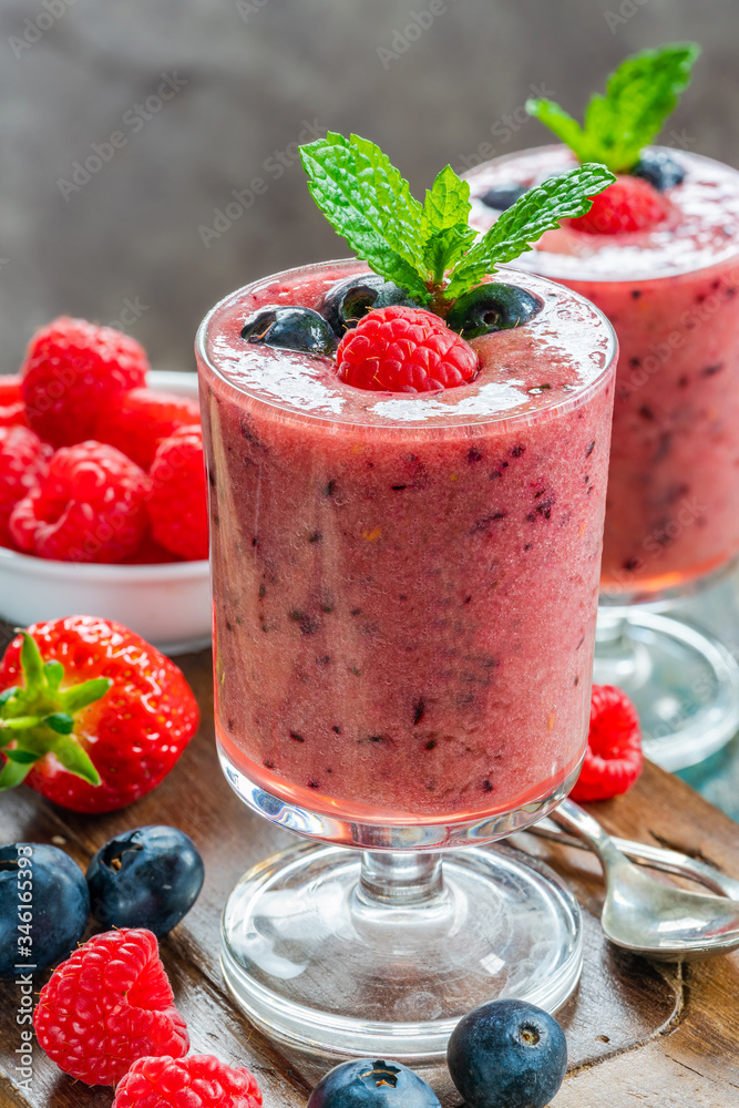 Mixed berry smoothie garnished with fresh fruit and mint Mixed berry smoothie garnished with fresh fruit and mint