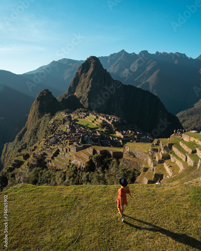 Girl Looking at one of the Worlds Wonder Machu Picchu