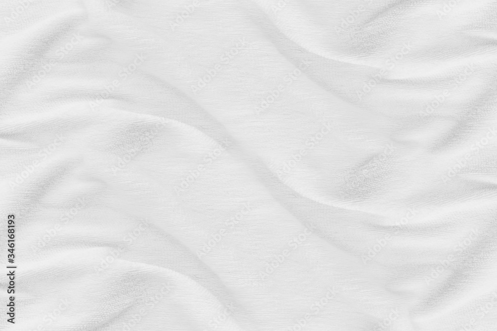 Close-up of white fabric texture background. Abstract crumpled cloth.