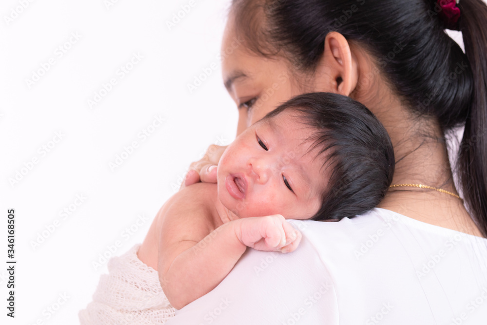 Young Asian beautiful mother holding newborn baby 0-1 month on her shoulder