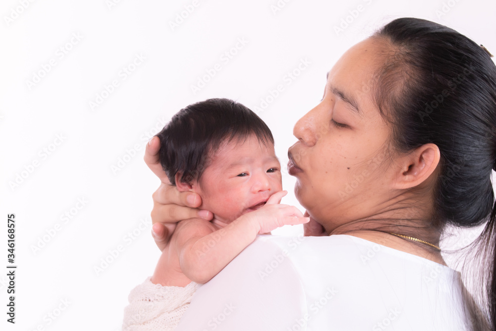 Asian newborn baby crying, hungry, sick on mother arm, Asian beautiful young mother hold infant worry her baby sickness, motherhood multi tasking at home Asian newborn baby crying, hungry, sick on mother arm, Asian beautiful young mother hold infant worry her baby sickness, motherhood multi tasking at home