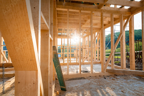 Interior frame of new wooden house under construction © leszekglasner