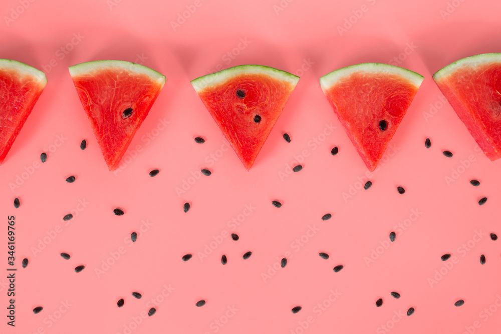 Flat lay, top view Sliced watermelon on pink background. Watermelon pattern.
