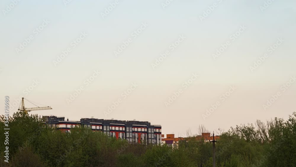 Timelapse, clouds moves above building and trees, at sunset time, 4k uhd. Timelapse, clouds moves above building and trees, at sunset time, 4k uhd.