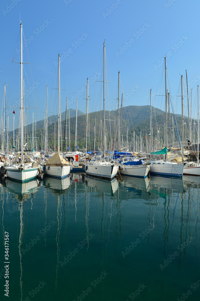 Marmaris marina with lot of yacht in it and sea reflection