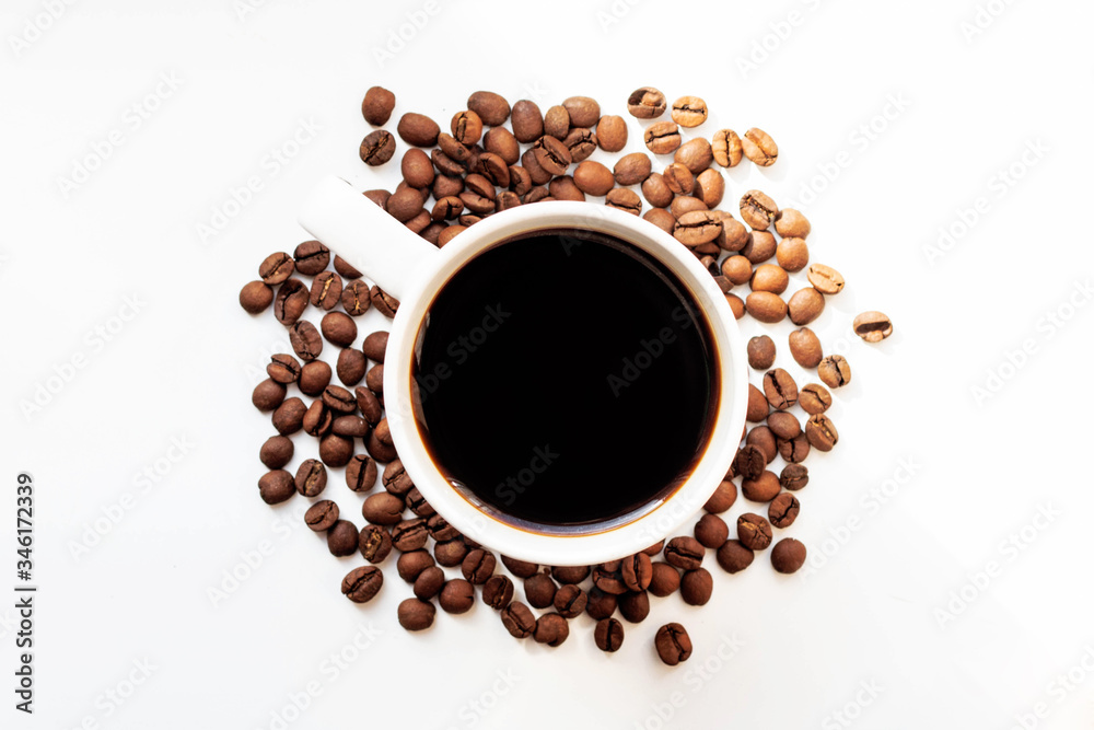coffee top view. black coffee on a white background around coffee beans. coffee in a white mug. coffee day. morning coffee coffee top view. black coffee on a white background around coffee beans. coffee in a white mug. coffee day. morning coffee
