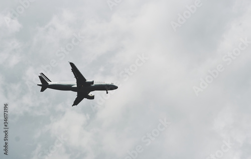 jetliner aircraft flying low pass over an airport