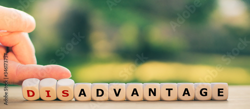Hand turns dice and changes the word 