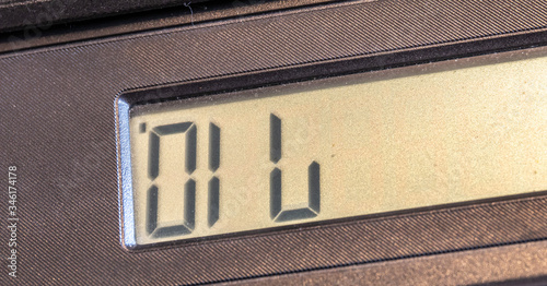 Old LCD calculator display upside down writing out a word oil