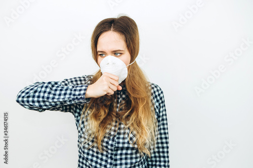 The girl wears a reperitor on a white background. Protective drugs against coronavirus. THE COVID 2019 epidemic. photo