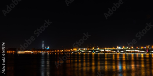 Night city lights over the river