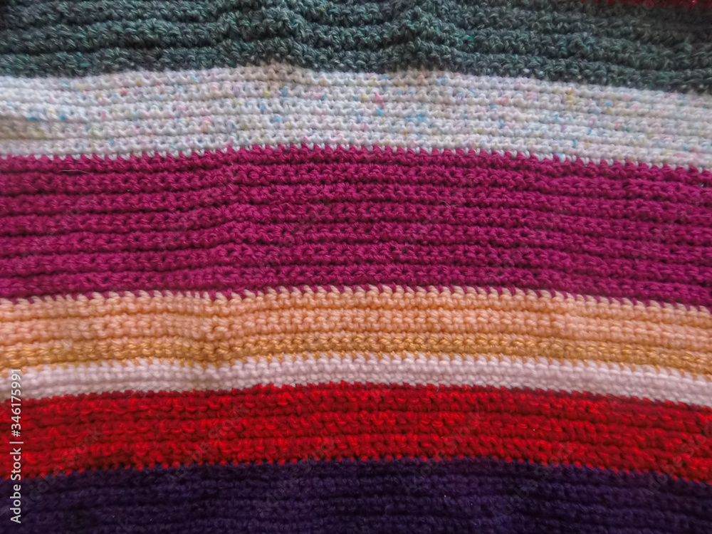 Crochet colored background. Colored stripes.