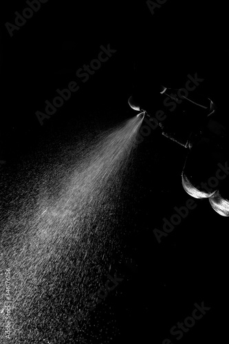 jet of water from the sprayer on a black background
