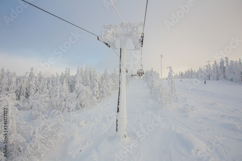 Ski lift in the snow mountains © Mishainik