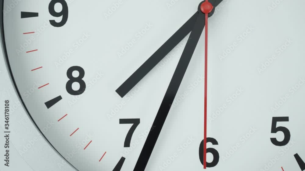 Closeup Gray wall clock shows time 7 o'clock, Time lapse moving fast, Time concept.
