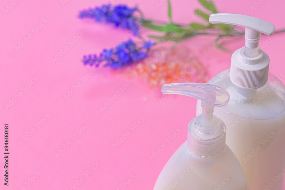 Liquid soap in clear bottle on color background, close up