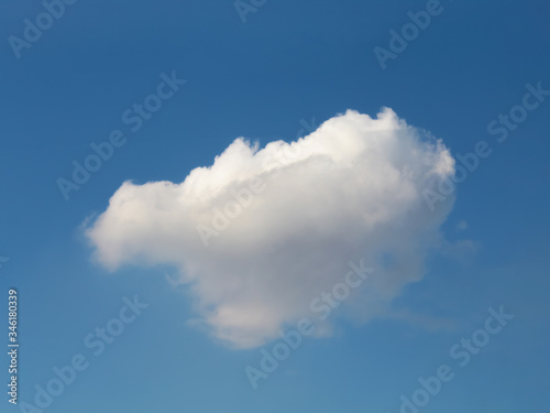 a large cloud against the blue sky