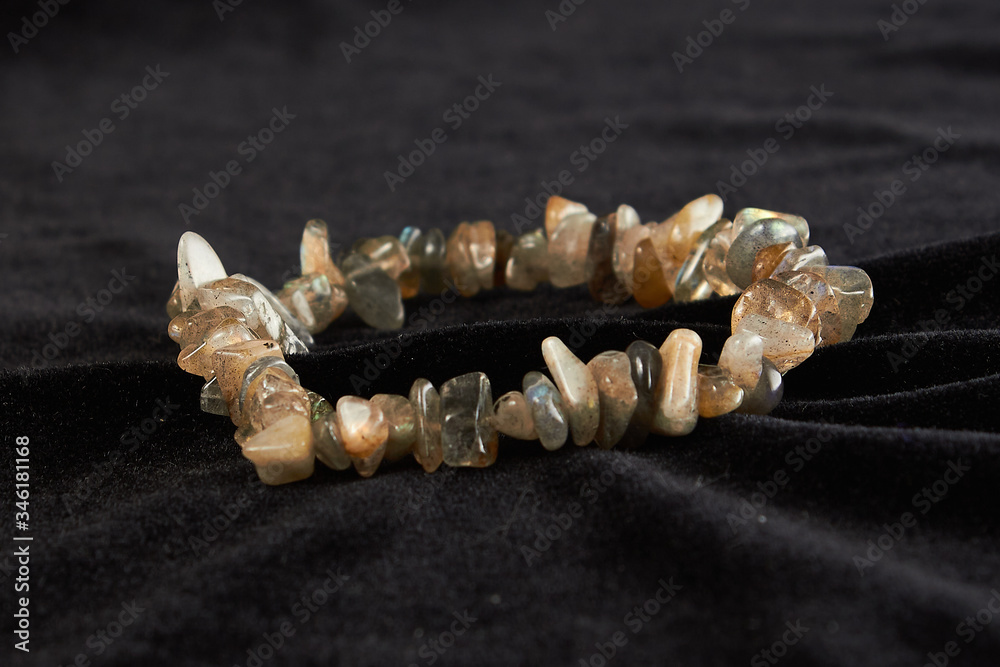 Fototapeta premium jasper bracelet semiprecious stone on black velor. close up