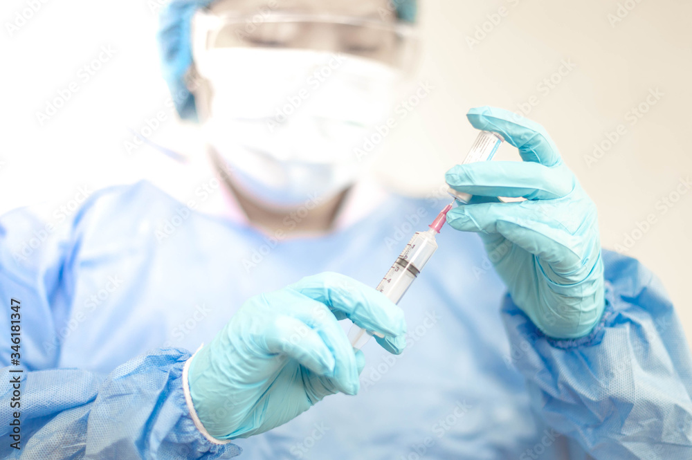 Syringe medical injection in hand holding with medicine dose vaccination equipment with needle. vaccination to patient for coronavirus (COVID-19) protection. Syringe medical injection in hand holding with medicine dose vaccination equipment with needle. vaccination to patient for coronavirus (COVID-19) protection.