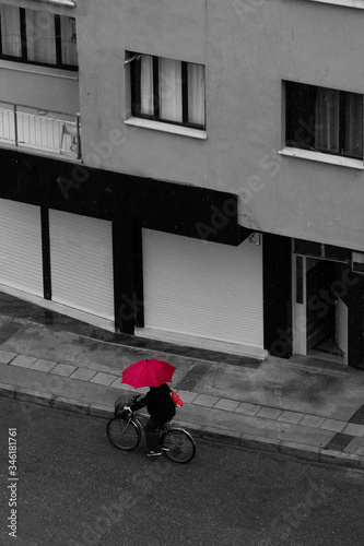 man on a bicycle in the rain
