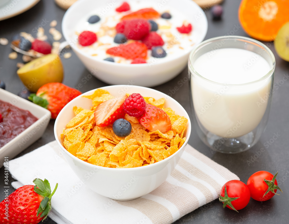 Breakfast Served in the morning with Coffee, Butter croissant and corn flakes Whole grains and raisins with milk in cups and Strawberry, Raspberry, Kiwi, Fresh Orange Juice on the breakfast table. Breakfast Served in the morning with Coffee, Butter croissant and corn flakes Whole grains and raisins with milk in cups and Strawberry, Raspberry, Kiwi, Fresh Orange Juice on the breakfast table.