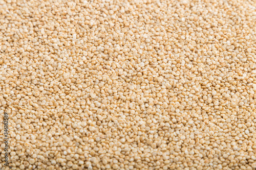 Texture of raw white quinoa. Side view, close up.
