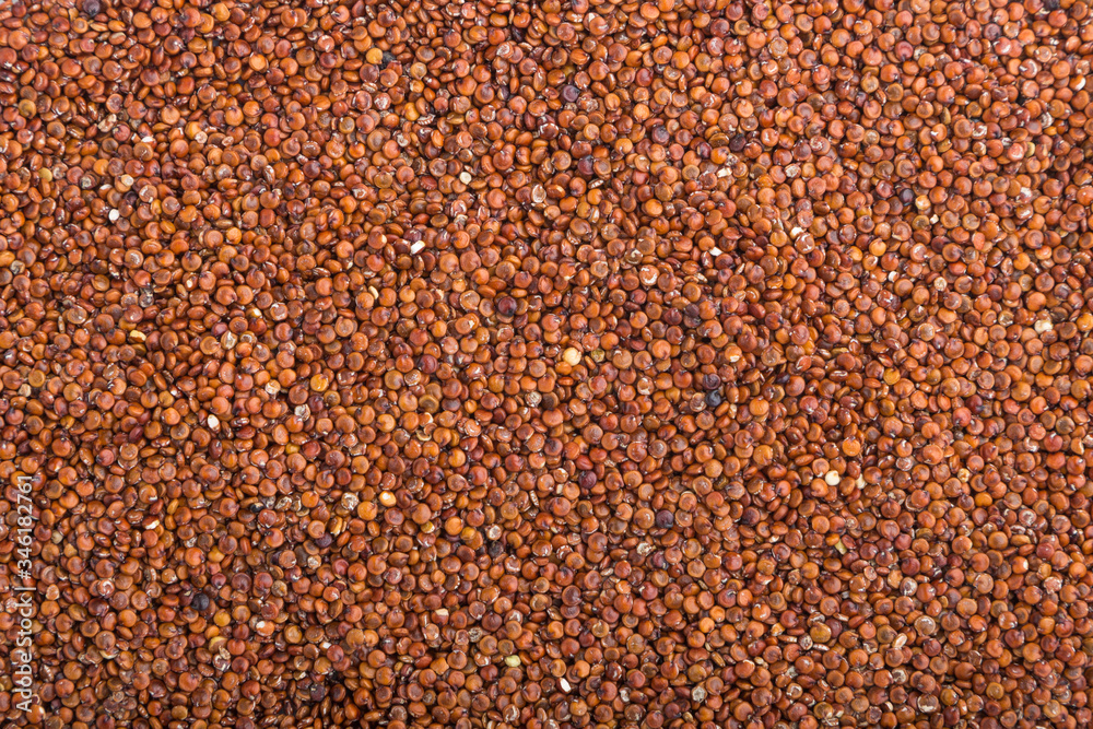Texture of raw red quinoa . Top view, close up.