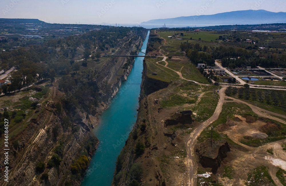 The Corinth Canal is a canal that connects the Gulf of Corinth with the Saronic Gulf in the Aegean Sea. It cuts Isthmus of Corinth and separates Peloponnese from the Greek mainland.