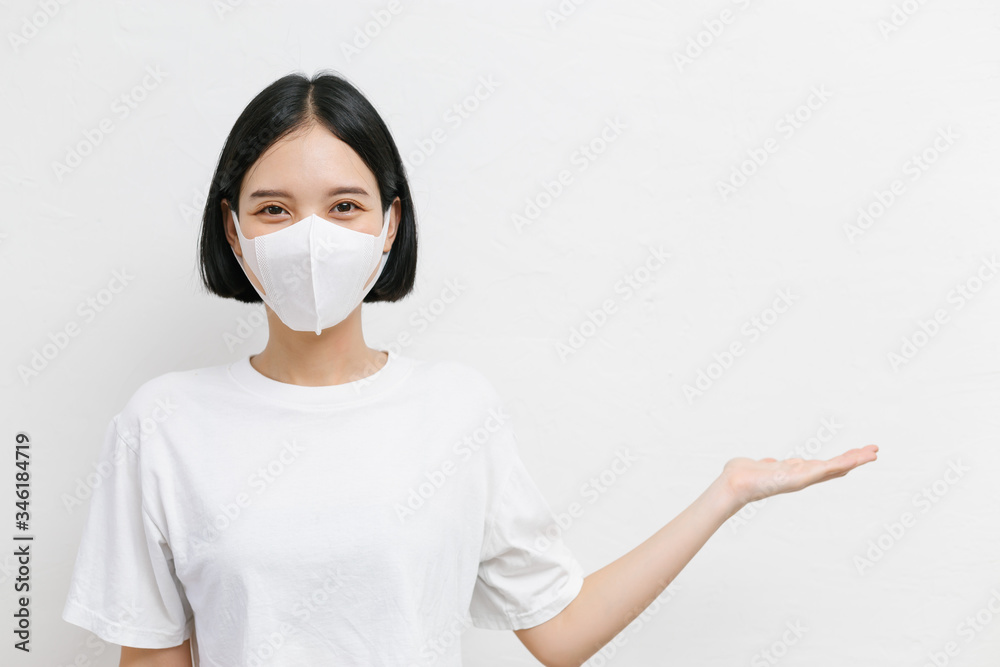 Young asian female wearing medical face mask to protect corona virus, studio portrait. Young asian female wearing medical face mask to protect corona virus, studio portrait.