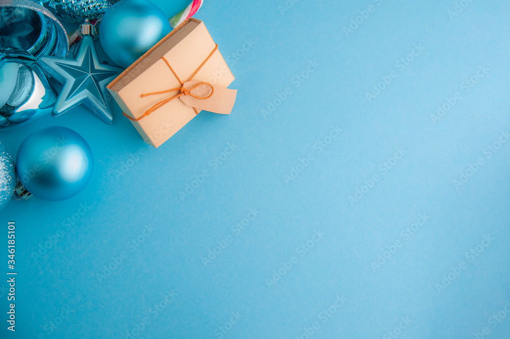 Christmas gift box and decorations on the blue background