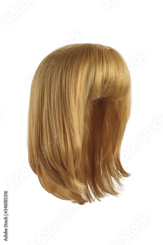 Subject shot of a natural looking straw blonde wig with bangs. The shoulder-long wig is isolated on the white background. 