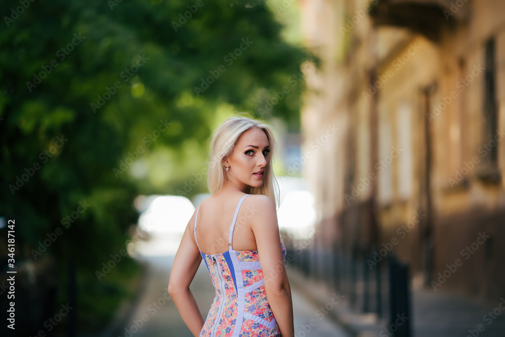Attractive young blonde woman posing outdoors lviv