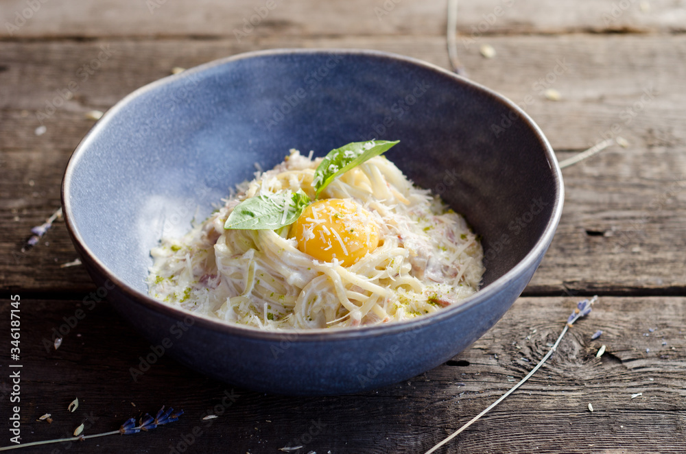 Carbonara pasta with bacon, cream sauce, Parmesan cheese and egg yolk. Traditional italian food. Carbonara pasta with bacon, cream sauce, Parmesan cheese and egg yolk. Traditional italian food.