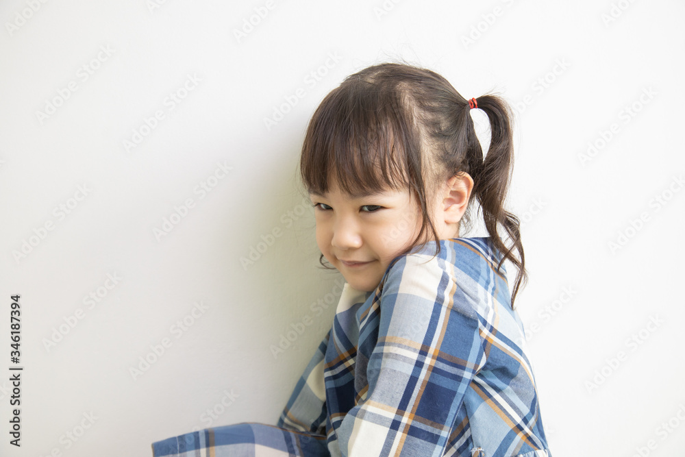 half-body and front-view photo of adorable, three-year-old Asian girl posing on a white background shows her brightness that makes people look happy, bright and cute. half-body and front-view photo of adorable, three-year-old Asian girl posing on a white background shows her brightness that makes people look happy, bright and cute.