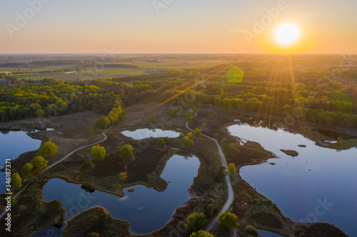 Aerial sunset photo of Hatertse Vennen nature reserve. Located in Heumen, Wijchen, Overasselt, Gelderlands, The Netherlands.  photo