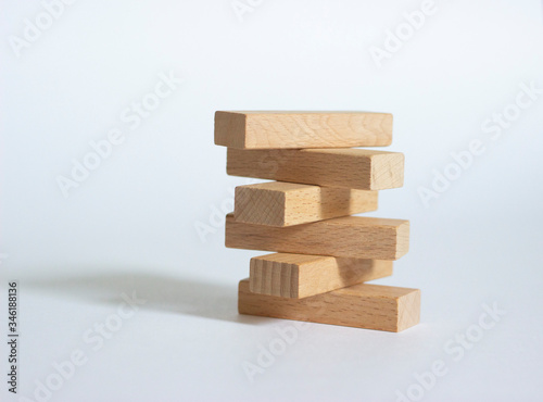 Wooden blocks are isolated on white paper. The concept of business and business games.