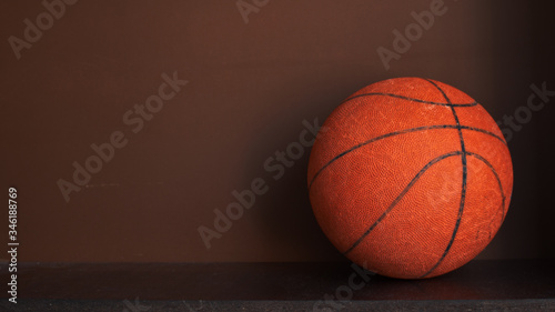 Basketball on wooden shelf with copy space