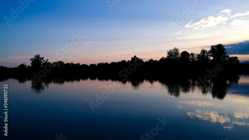 Sunrise with a lake in the foreground