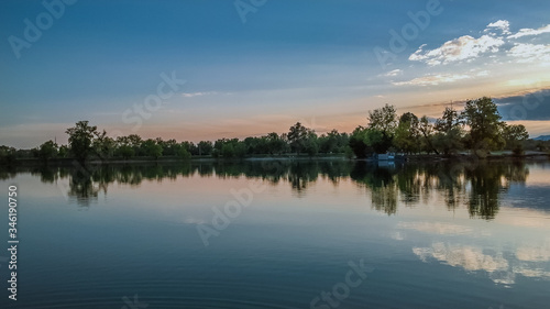 Sunrise with a lake in the foreground