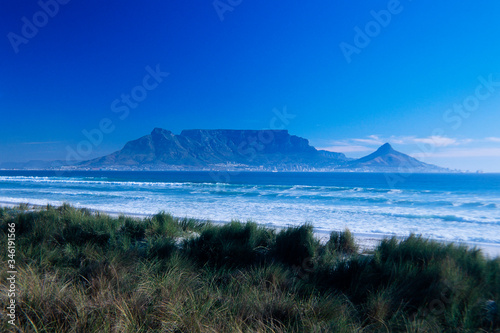 Table Mountain and Cape Town seen from across Table Bay.
Bloubergstrand Beach in the forreground.