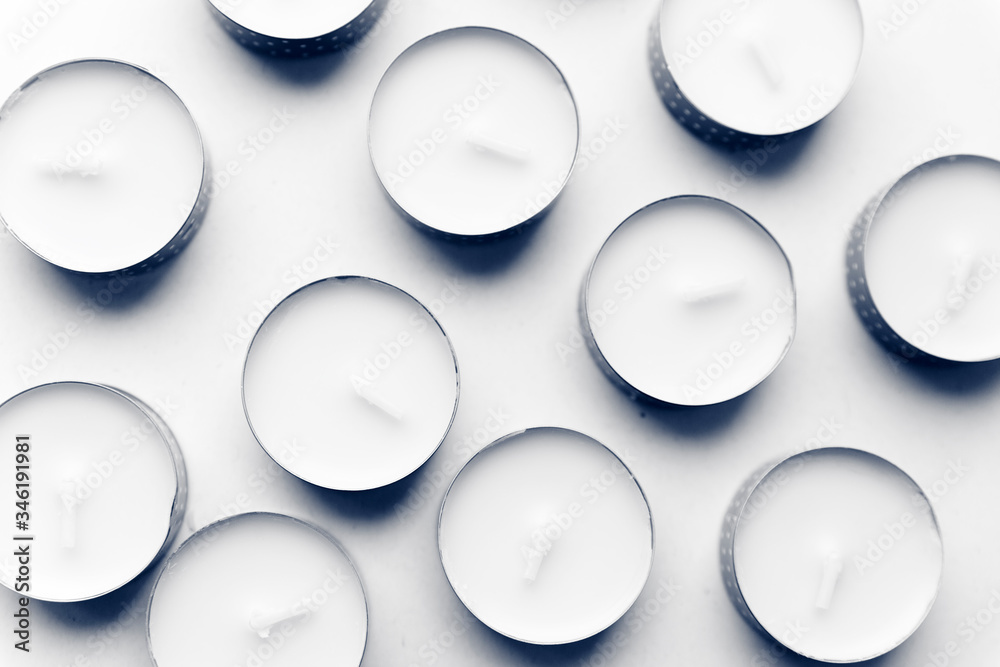 A lot of candles on a white background, tinted photo
A lot of candles on a white background, tinted photo