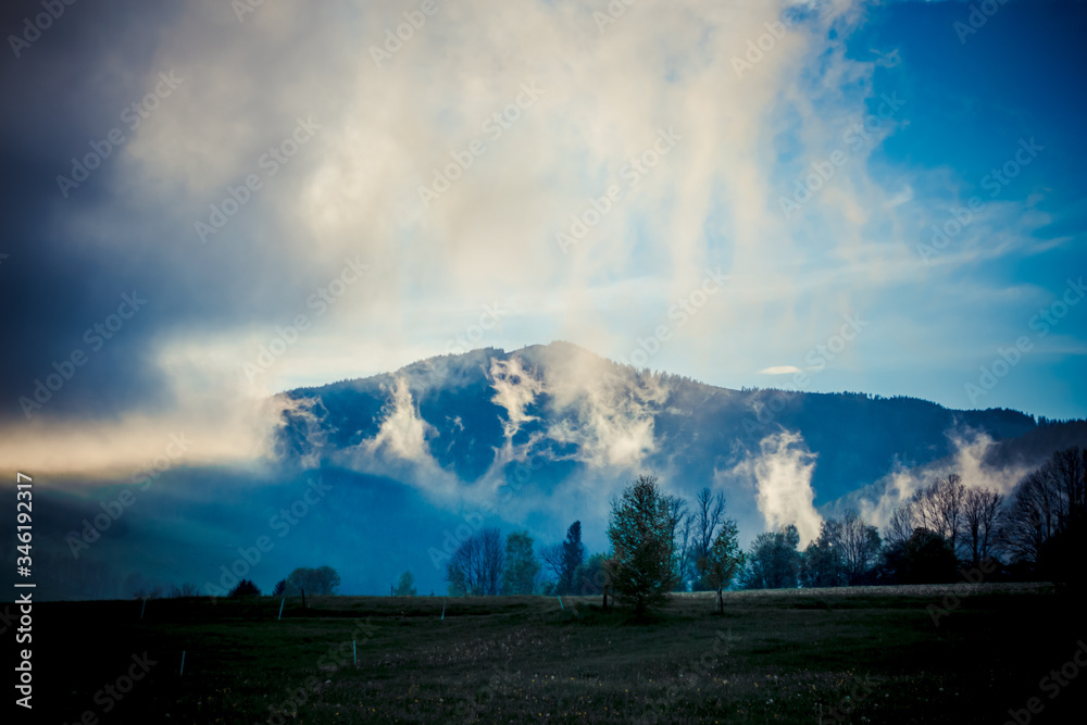 Beautiful foggy landscape in the mountains after rain, Alps, Austria.