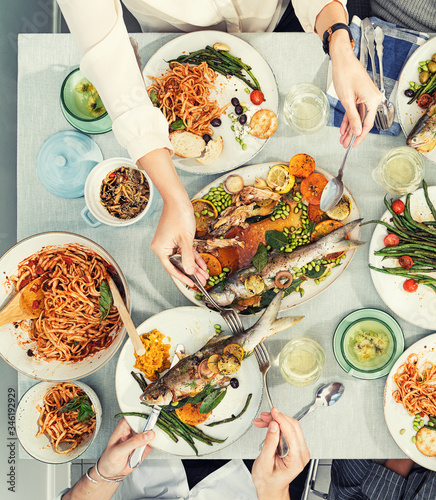 Overhead view of woman serving food at table