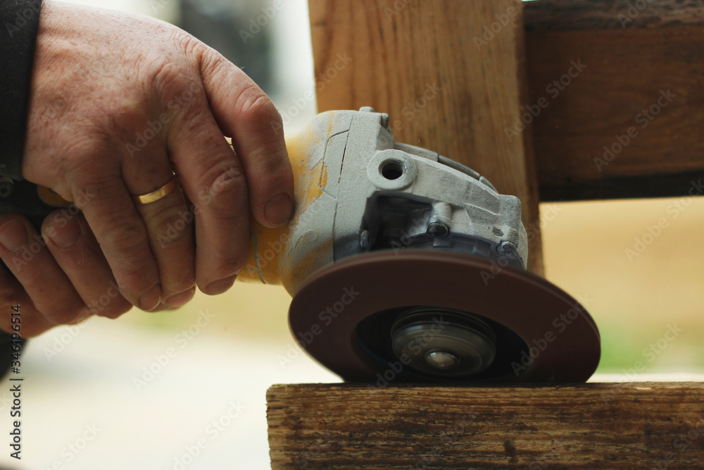 close up of hands cutting wood close up of hands cutting wood