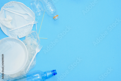 Wallpaper Mural Plastic waste, plastic utensils on a blue background,flat lay. Say no to single use plastic. Ecology environmental care.Copy space for text. Torontodigital.ca