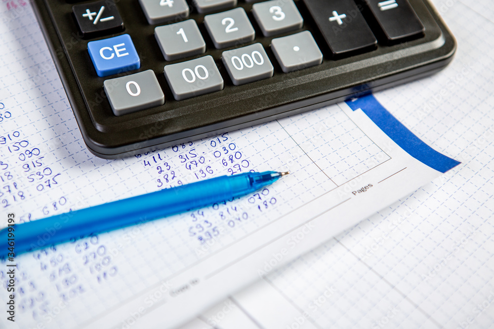 Pen and calculator. Background Items for doing business in the office in the composition. Pen and calculator. Background Items for doing business in the office in the composition.