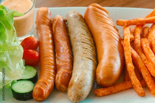mixed grilled sausage with sweet potato fries