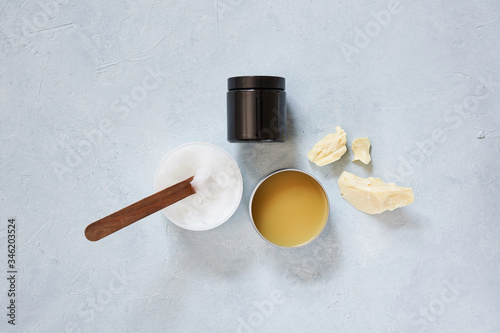 Natural ingredients and accessories for diy cosmetics and home spa treatment on turquoise background, top view.